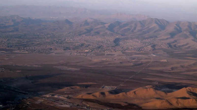 Aerial view of the Anthem area of Henderson at dusk, with desert hills beyond
