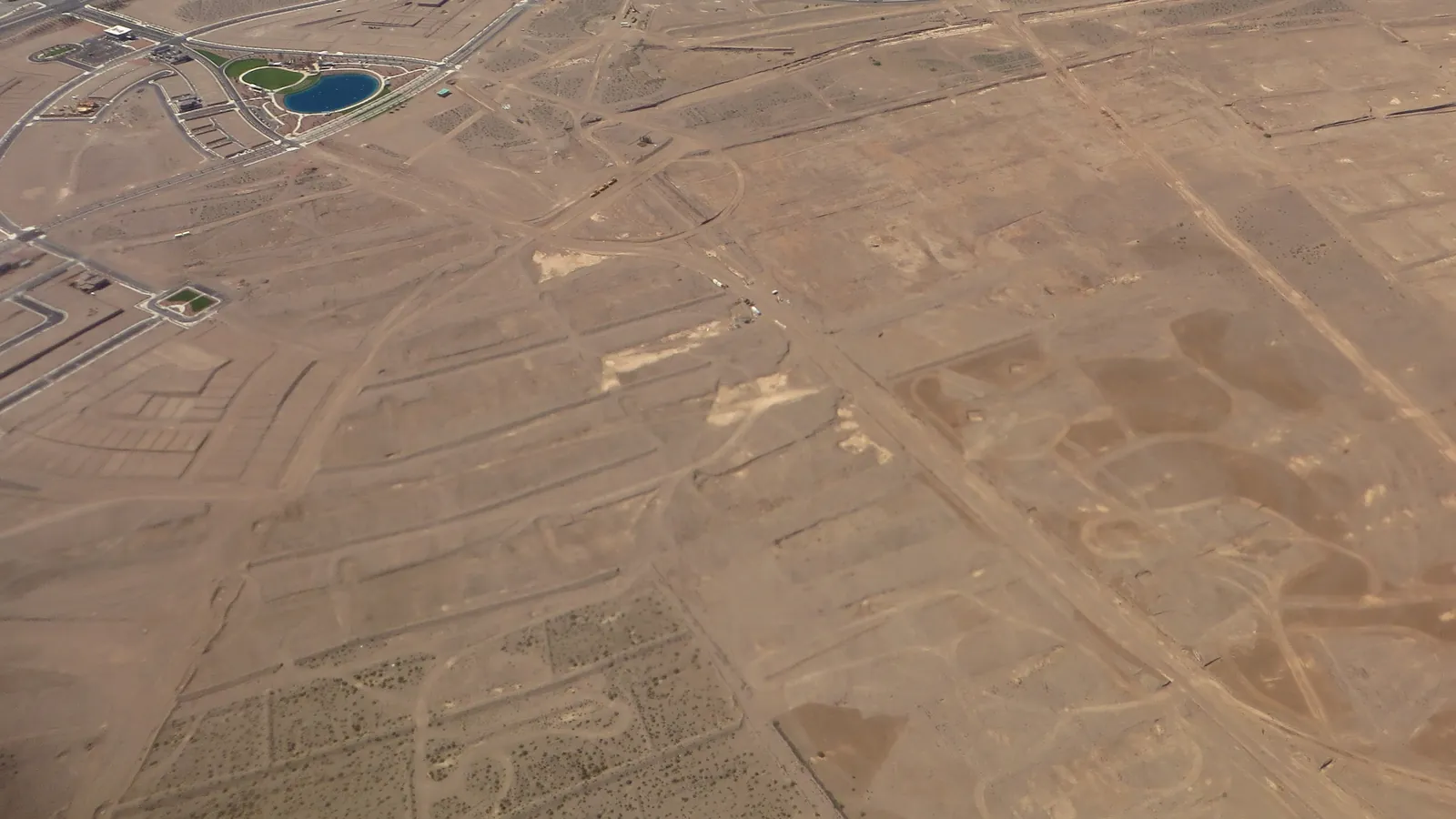 Aerial view of cleared desert lots with roads laid out for a new housing development in Henderson, Nevada