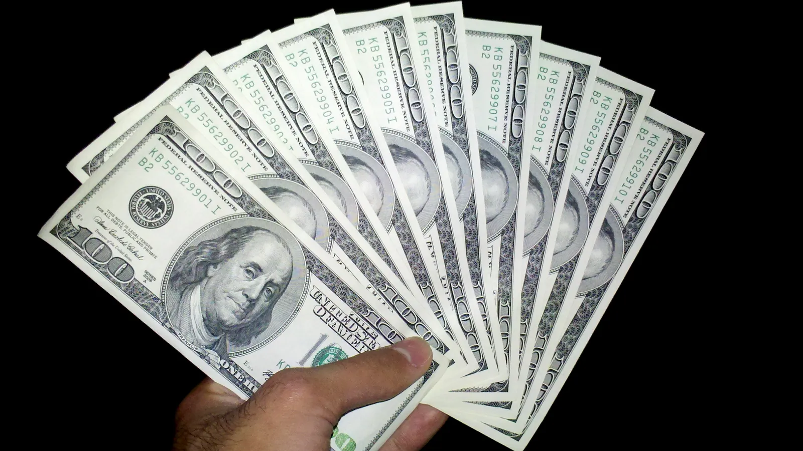 A fan of US one hundred dollar bills